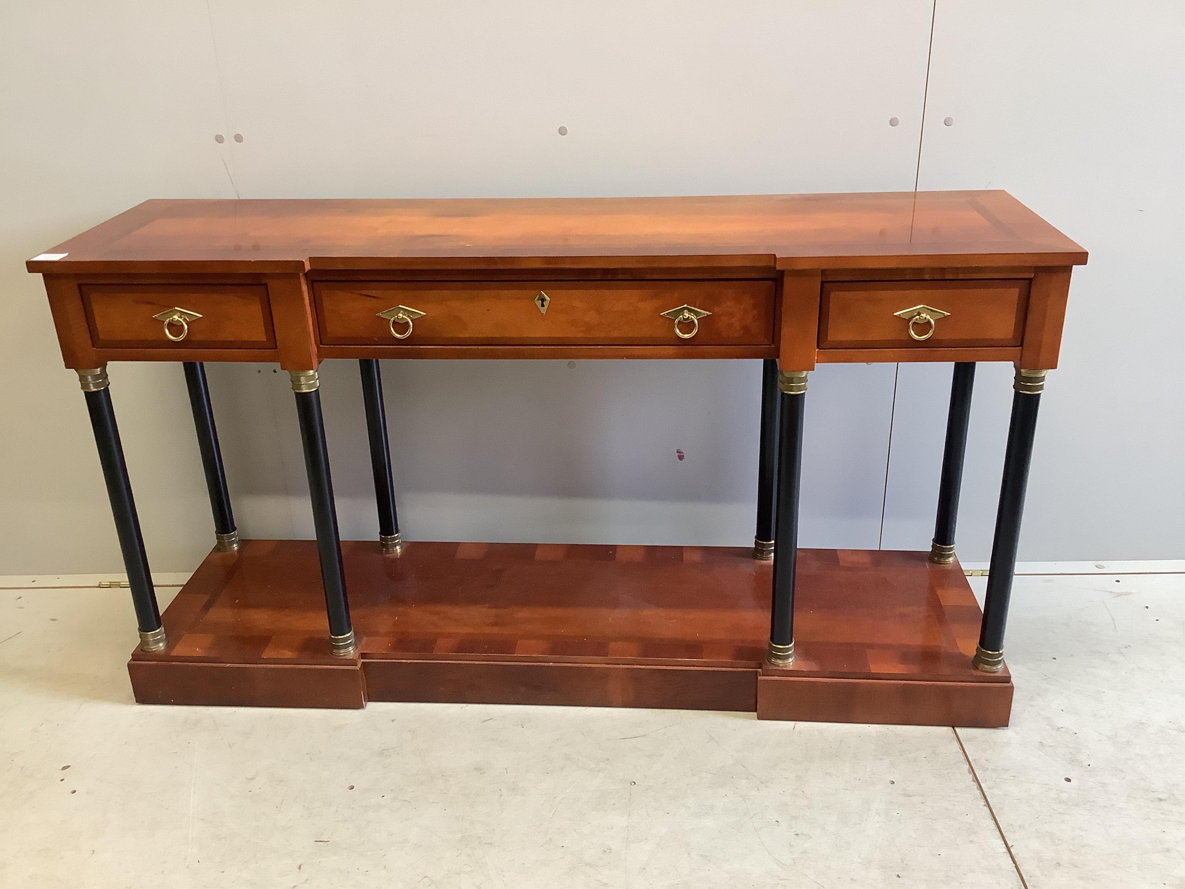 A French Empire style mahogany and ebonised three drawer console table, width 147cm, depth 41cm, height 79cm. Condition - fair to good